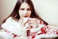 Young pretty brunette girl in Christmas ornament blanket getting warm on cold winter, freshness beauty concept Royalty Free Stock Photo