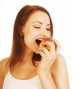 Young pretty brunette girl eating red apple isolated on white Royalty Free Stock Photo