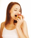 Young pretty brunette girl eating red apple isolated on white Royalty Free Stock Photo