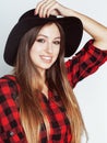 Young pretty brunette girl hipster in hat on white background casual close up dreaming smiling, lifestyle people concept Royalty Free Stock Photo