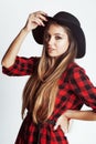 Young pretty brunette girl hipster in hat on white background casual close up dreaming smiling. real american woman