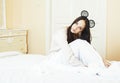 Young pretty brunette woman laying in bed alone waiting, lifestyle people concept at home Royalty Free Stock Photo