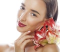 Young pretty brunette woman with red flower amaryllis close up isolated on white background. Fancy fashion makeup Royalty Free Stock Photo