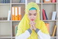 Young business arab middle eastern muslim woman thinking at the workplace