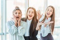 Young pretty business girls show a good gesture. Dressed in classic clothes Royalty Free Stock Photo