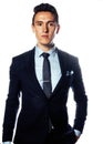 Young pretty business man standing on white background, modern hairstyle, posing emotional, lifestyle people concept Royalty Free Stock Photo