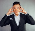 Young pretty business man standing on white background, modern hairstyle, posing emotional, lifestyle people concept Royalty Free Stock Photo