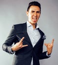 Young pretty business man standing on white background, modern hairstyle, posing emotional, lifestyle people concept Royalty Free Stock Photo