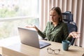 Young pretty business woman in a hopeless situation on her laptop Royalty Free Stock Photo