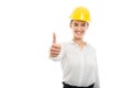 Young pretty business woman showing thumb up gesture wearing helmet Royalty Free Stock Photo