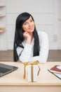 Young pretty business woman sitting at the desk Royalty Free Stock Photo