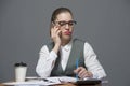 Pretty businesswoman pouting making a call Royalty Free Stock Photo