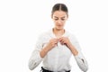 Young pretty bussines woman buttoning shirt gesture