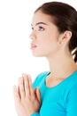 Young pretty caucasian girl praying Royalty Free Stock Photo