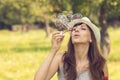 Young pretty caucasian woman having fun with blowing bubbles Royalty Free Stock Photo