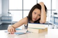 Young pretty chinese asian student woman working paperwork and books tired and bored Royalty Free Stock Photo