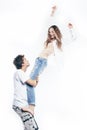 Young pretty couple together posing cheerful isolated on white background, lifestyle people concept, happy boy and girl