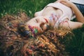 A Young Girl Laying At The Grass Royalty Free Stock Photo