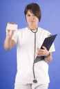 Young and pretty doctor with stethoscope and card Royalty Free Stock Photo