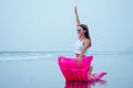 Young pretty fashion woman body posing in summer with mattress in black bikini and having fun Royalty Free Stock Photo