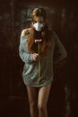 Young pretty female wearing respirator, allergy concept