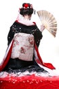 Young pretty geisha in kimono with sakura and decoration Royalty Free Stock Photo