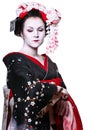 Young pretty geisha in kimono with sakura and decoration Royalty Free Stock Photo