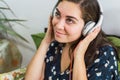 Young pretty girl with her cell phone, listening music Royalty Free Stock Photo