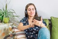 Young pretty girl with her cell phone, listening music Royalty Free Stock Photo