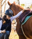 Young pretty girl - riding a horse in winter morning Royalty Free Stock Photo