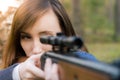 Young pretty girl with rifle Royalty Free Stock Photo