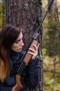 Young pretty girl with rifle Royalty Free Stock Photo