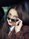 Young pretty girl sitting behind the wheel of a car Royalty Free Stock Photo