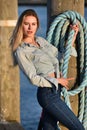 Young pretty girl standing on a pier. Royalty Free Stock Photo