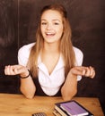 Young pretty girl student in classroom at blackboard Royalty Free Stock Photo