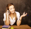 Young pretty girl student in classroom at blackboard Royalty Free Stock Photo