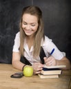 Young pretty girl student in classroom at Royalty Free Stock Photo