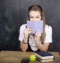 Young pretty girl student in classroom at Royalty Free Stock Photo