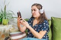 Young pretty girl with her cell phone, listening music Royalty Free Stock Photo