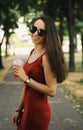 Young pretty girl walking down the street Royalty Free Stock Photo