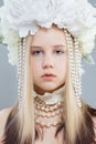 Young pretty girl in white spring flower wreath, close up beauty portrait Royalty Free Stock Photo