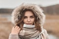 Young pretty girl in winter hood. The retro and vintage style