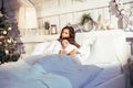 Young pretty girls in bed at Christmass morning, happy family smiling lifestyle at holiday Royalty Free Stock Photo