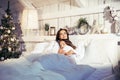 Young pretty girls in bed at Christmass morning, happy family smiling lifestyle at holiday Royalty Free Stock Photo