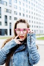 Young pretty hipster girl student with coffee cup posing adorable smiling, lifestyle people concept outdoor Royalty Free Stock Photo