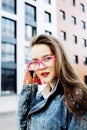 Young pretty hipster girl student with coffee cup posing adorable smiling, lifestyle people concept outdoor Royalty Free Stock Photo