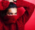 Young pretty indian girl in red sweater posing emotional, fashion hipster teenage, lifestyle people concept