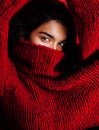 Young pretty indian mulatto girl in red sweater posing emotional, fashion hipster teenage, lifestyle people concept Royalty Free Stock Photo