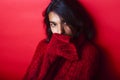 Young pretty indian mulatto girl in red sweater posing emotional Royalty Free Stock Photo