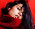 Young pretty indian mulatto girl in red sweater posing emotional, fashion hipster teenage, lifestyle people concept Royalty Free Stock Photo